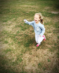 Girl running on field