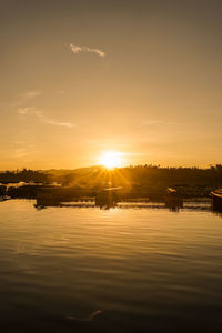 Scenic view of lake against sky during sunset