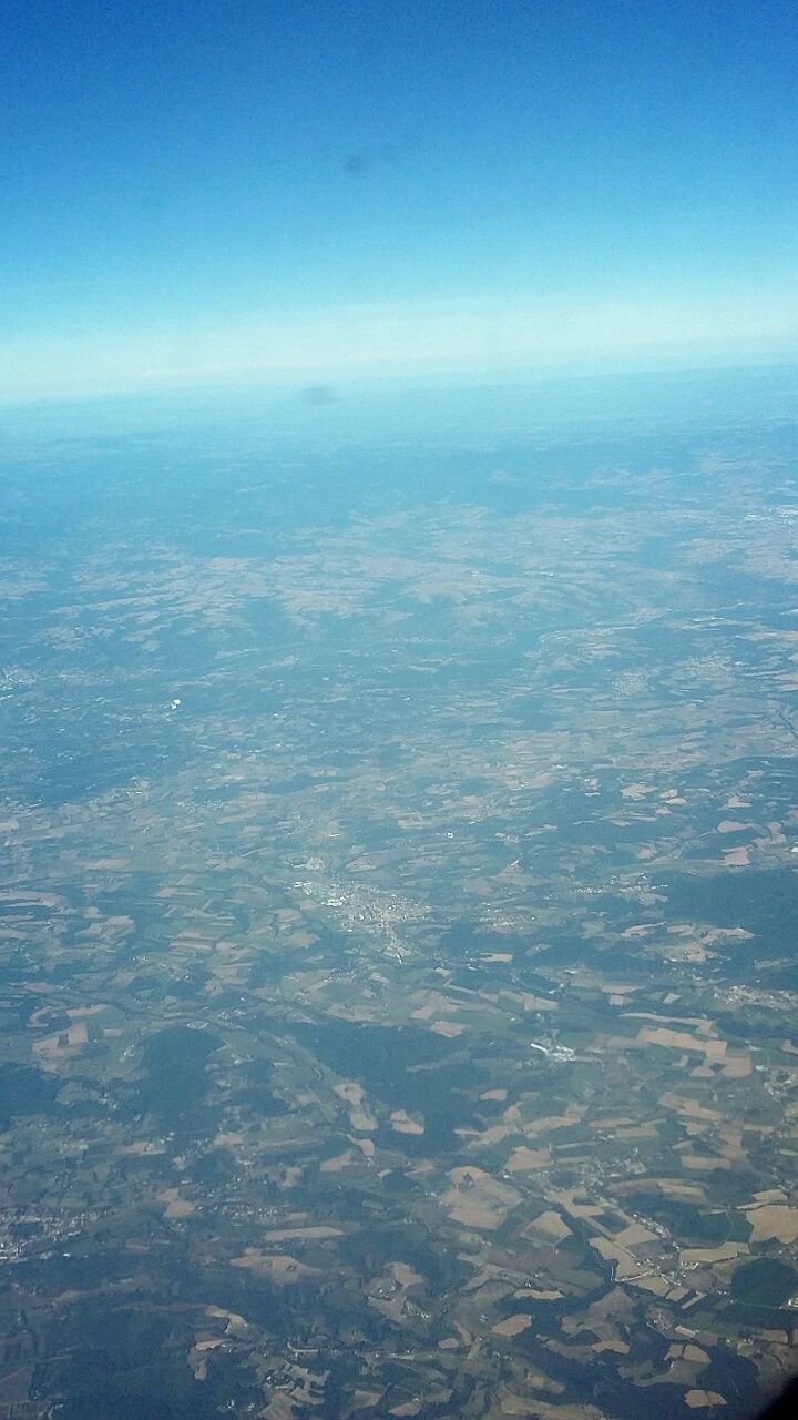 aerial view, blue, scenics, beauty in nature, tranquil scene, landscape, tranquility, nature, sky, idyllic, copy space, day, horizon over land, no people, outdoors, high angle view, cloud - sky, cloud, clear sky, mountain