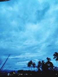 Low angle view of silhouette trees against sky