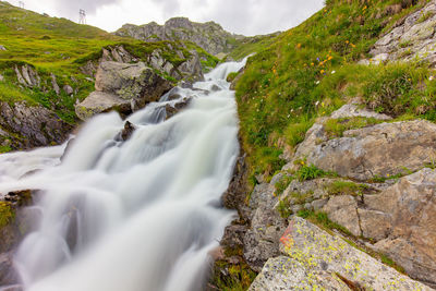 Scenic view of stream flowing through rocks