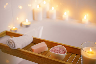 Close-up of candles on table