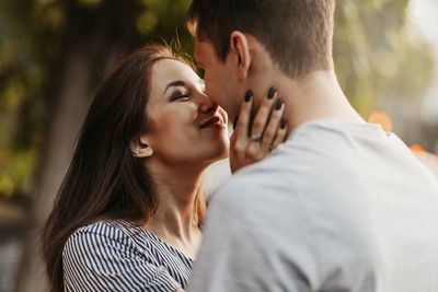 Young couple kissing outdoors