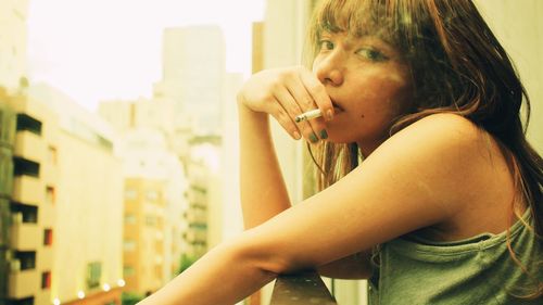 Side view of man smoking cigarette