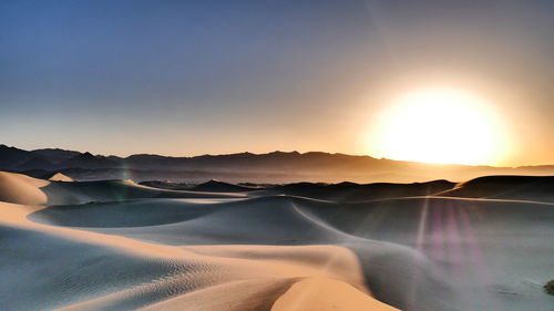 Scenic view of landscape against sky during sunset