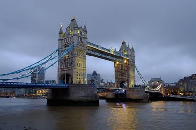 View of bridge over river in city