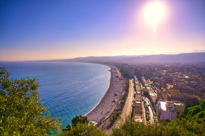 High angle view of sea against sky at sunset