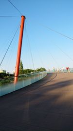 View of suspension bridge against clear sky