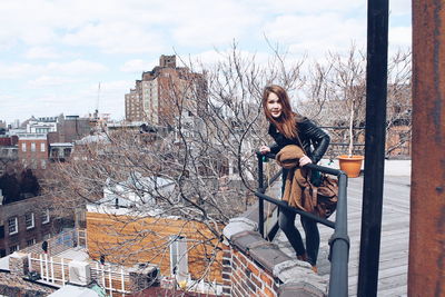 Woman standing in front of building