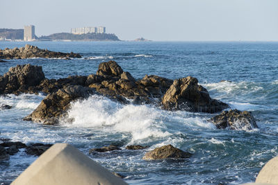 Sea waves splashing on rocks