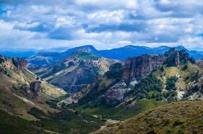 Scenic view of mountains against cloudy sky