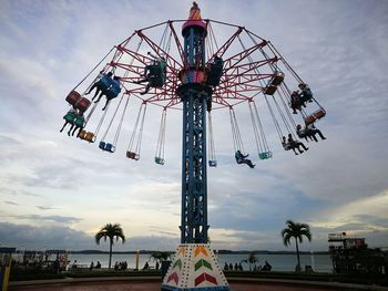 Low angle view of ferris wheel against sky