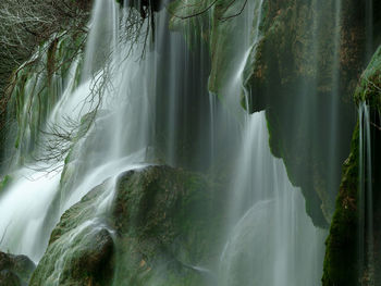 Panoramic view of waterfall in forest