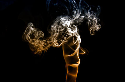 Close-up of smoke against black background