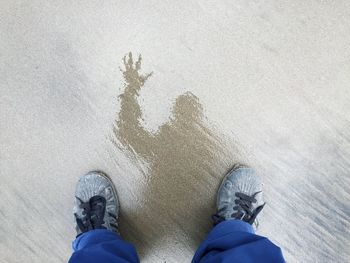 Low section of person standing on street