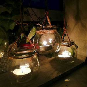 Illuminated light bulb hanging on table