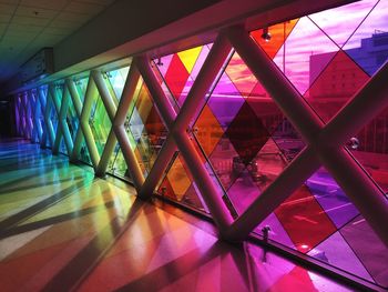 Low angle view of illuminated glass building