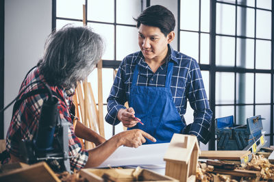 Friends working on table