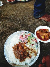 High angle view of man preparing food on table