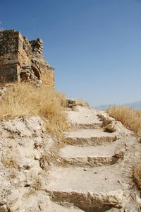 Stone steps against clear sky