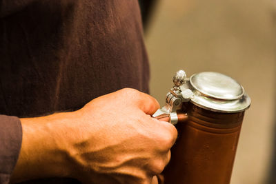 Close-up of hand holding metal