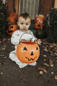 Adorable toddler boy dressed up as mummy on halloween trick-or-treat