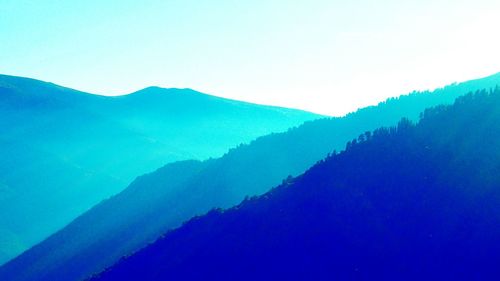 Scenic view of mountains in foggy weather