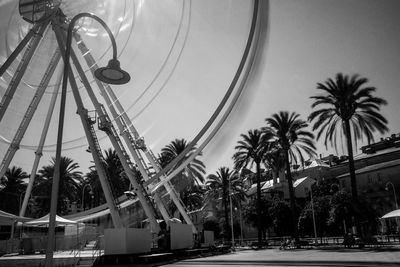 Low angle view of ferris wheel against sky