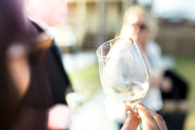 Cropped image of hand holding wineglass