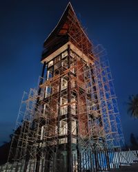 Low angle view of building against blue sky