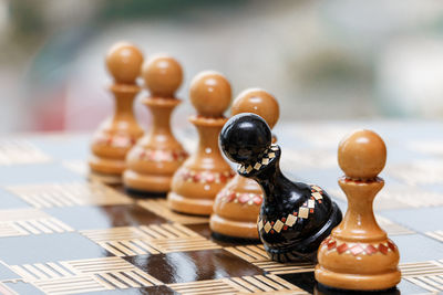 Close-up of chess pieces on table