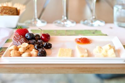 Close-up of served fruits in plate on table