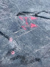 High angle view of arrow sign on road in city