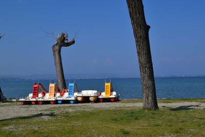 Lifeguard hut on beach against clear sky