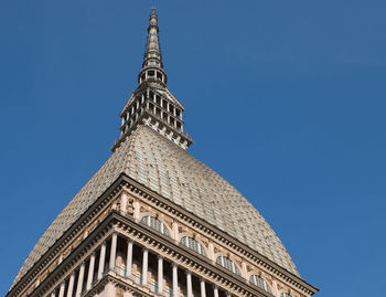 Low angle view of building against blue sky