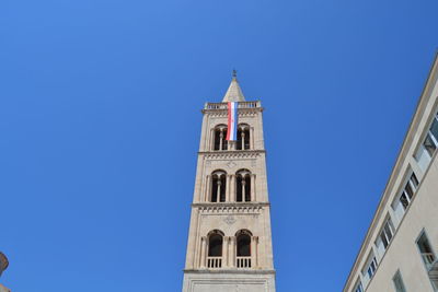 Low angle view of building against blue sky