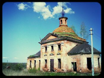 Low angle view of built structure against blue sky