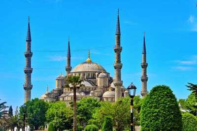 The blue mosque on a clear summer day with green vegetation, istanbul. 