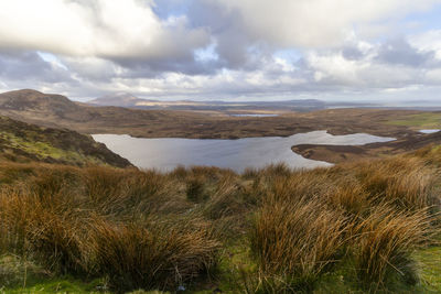 Panoramic view of landscape against cloudy sky