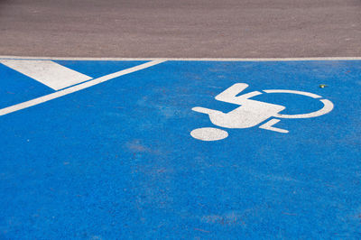 High angle view of parking sign on road