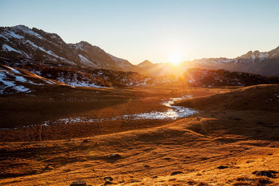 Scenic view of mountains against sky during sunset