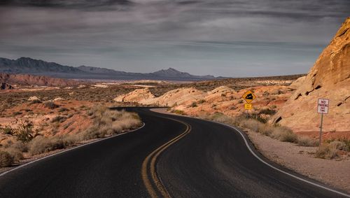 Road amidst landscape against sky