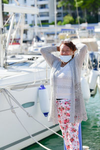 Young woman standing against blurred background