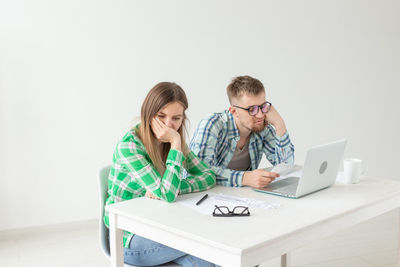 Friends sitting on table