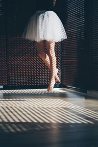 Full length of woman standing by railing