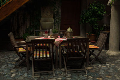 Empty chairs and tables in building