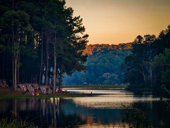 Scenic view of lake against sky during sunset