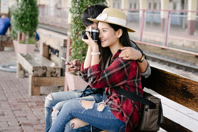 Young woman using mobile phone outdoors