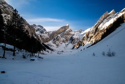 Scenic view of mountains against sky during winter