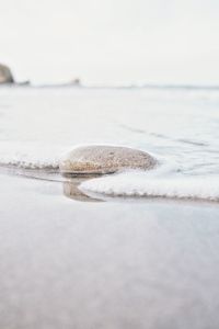 Surface level of beach against sky